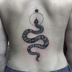 Ornamental snake tattoo on the back