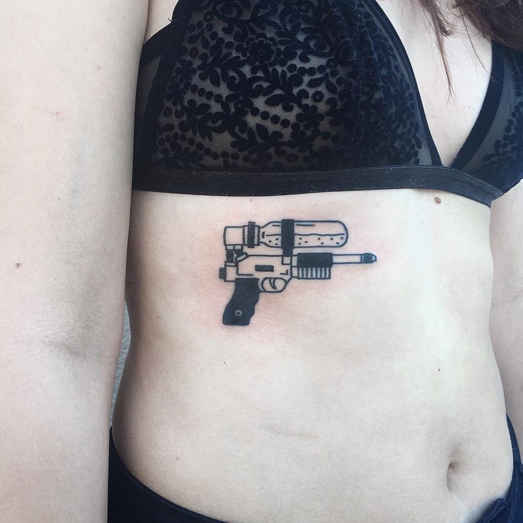 Paintball gun tattoo.