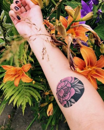 Pink circular flower tattoo