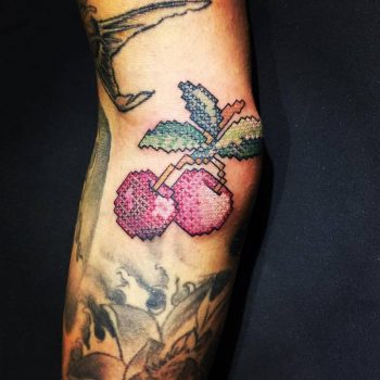 Pixel art cherries tattoo