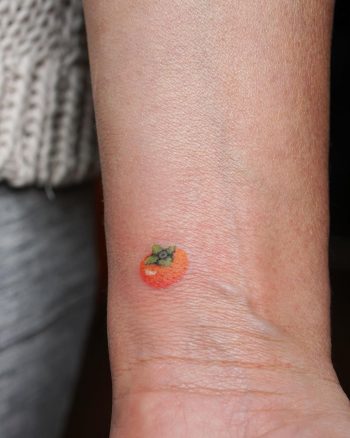 Poked persimonn tattoo