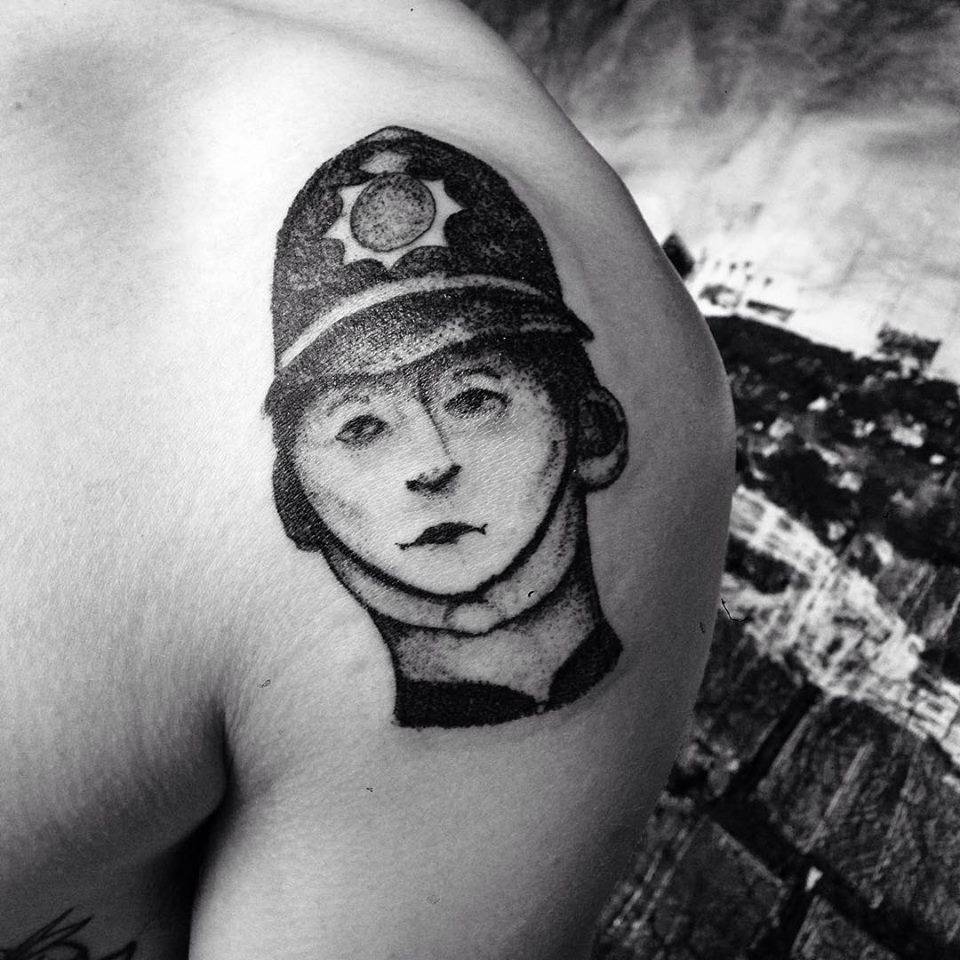 Post ironic tattoo of a 1940s british policeman