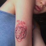 Red heart and brains tattoo
