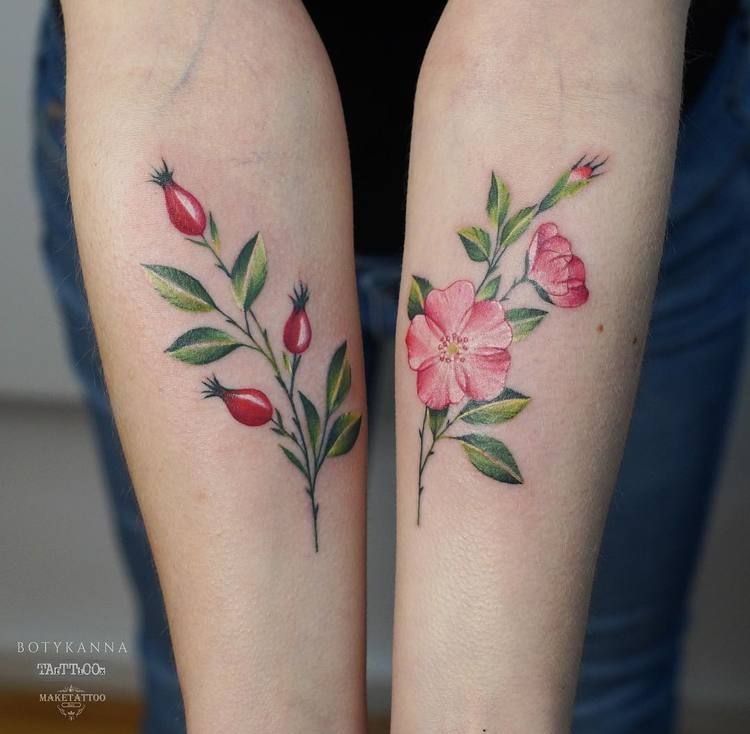 Ref and green flowers on both forearms