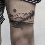 Road tattoo on the thigh