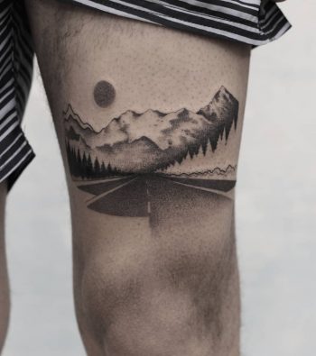 Road tattoo on the thigh
