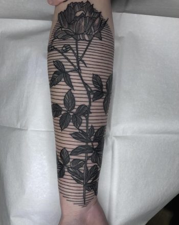 Rose and linear pattern tattoo