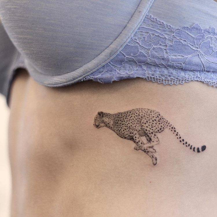 Running cheetah tattoo