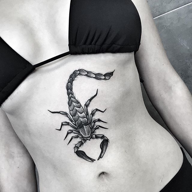 Scorpion tattoo on the belly