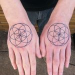 Seed of life tattoos on hands