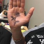 Simple rose tattoo on the palm