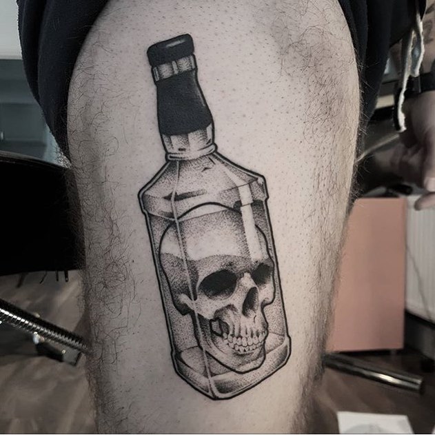 Skull in a bottle tattoo