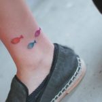 Small fish tattoo on the ankle