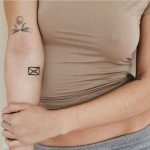 Small letter tattoo on the forearm