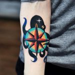 Squid and compass rose tattoo
