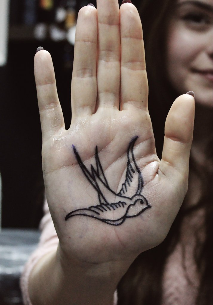 Swallow tattoo on the palm