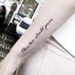 This too shall pass tattoo on the forearm