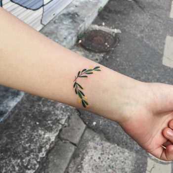Tiny branches tattoo on the wrist