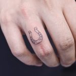Tiny horseshoe tattoo