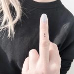 Tiny semicolon tattoo