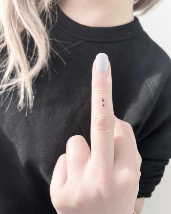 Tiny semicolon tattoo