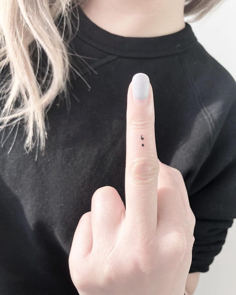 Tiny semicolon tattoo 