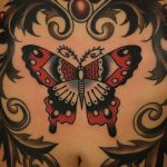 Traditional butterfly tattoo on the belly