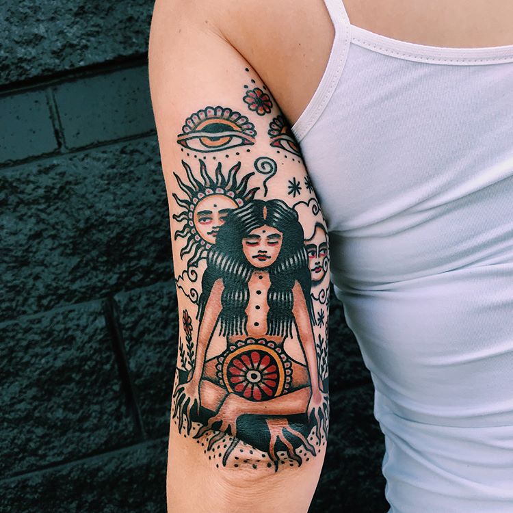 Traditional style tattoo of a meditating girl