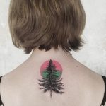 Tree and pink circle tattoo