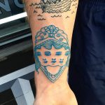 Tripple blue face tattoo