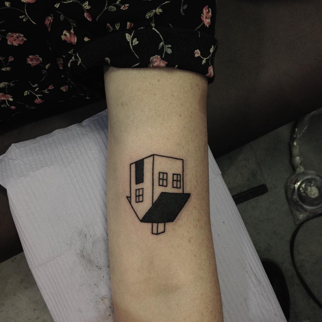 Upside down linear house tattoo