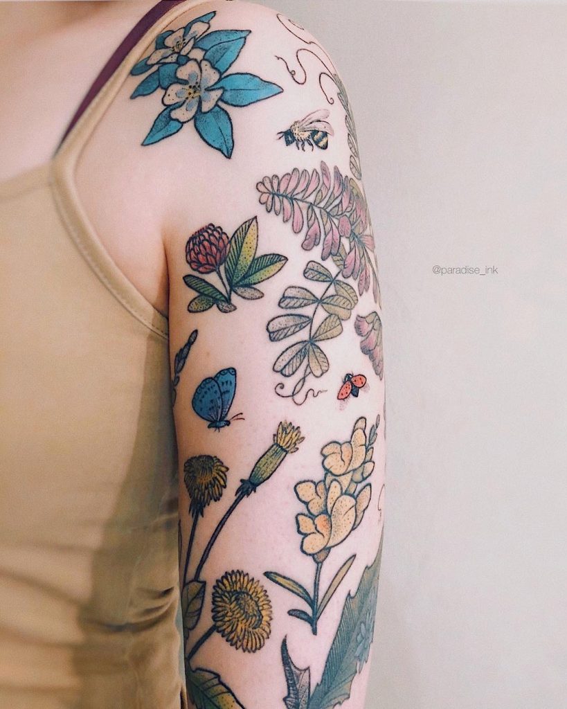 Various flower tattoos on the left arm