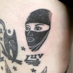 Veiled woman tattoo