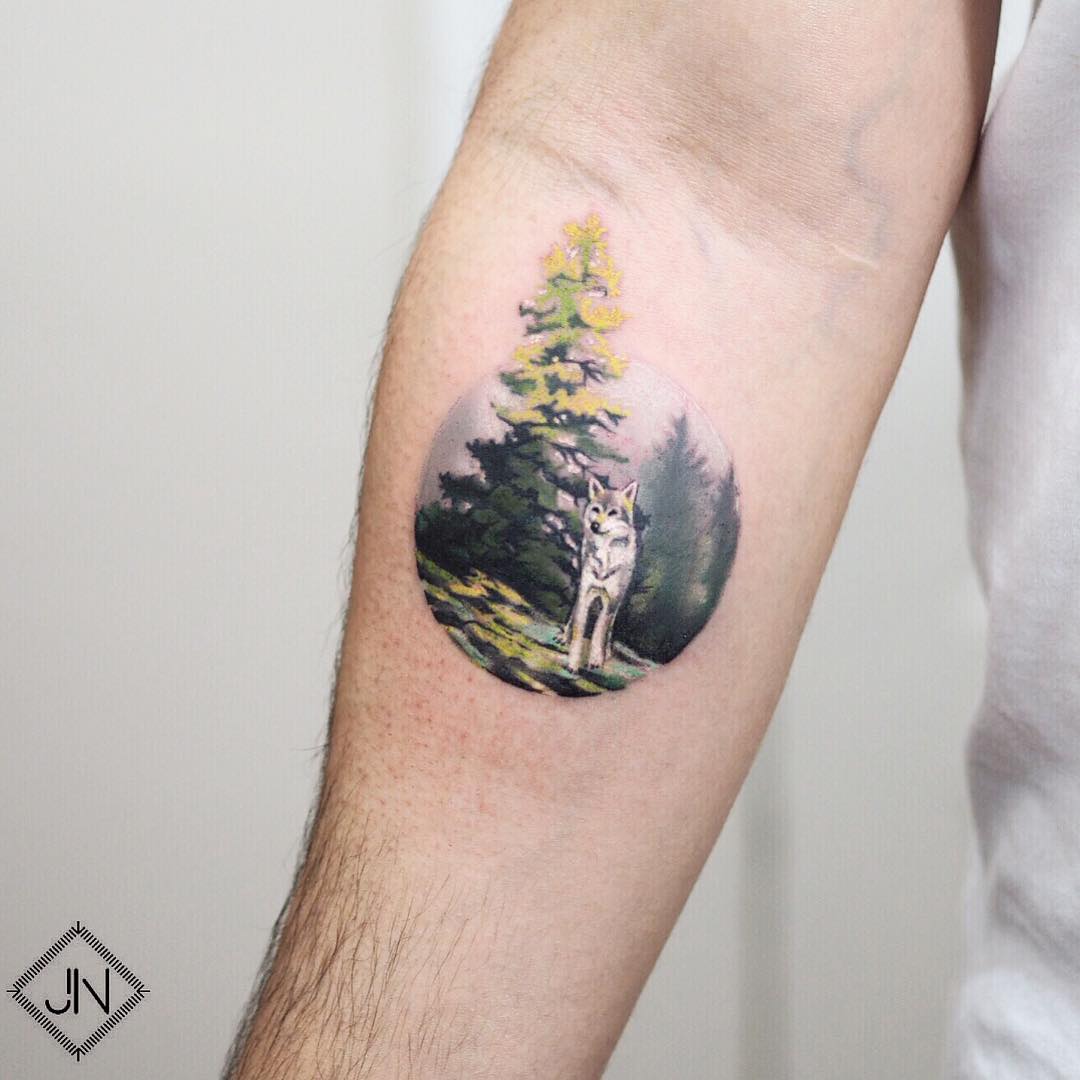 Wolf in a forest tattoo