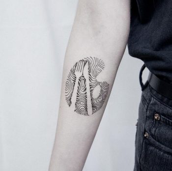 Abstract fork and knife tattoo