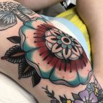 American traditional flower tattoo on the knee