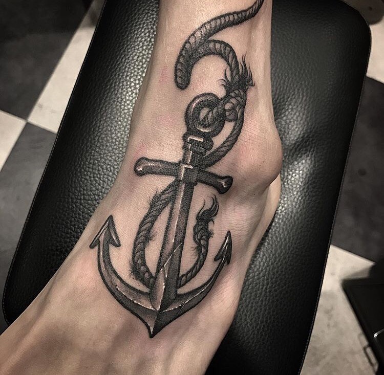 Anchor and rope tattoo on the foot