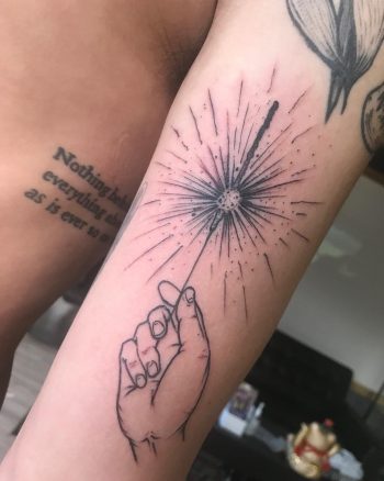 Awesome linework sparkler tattoo