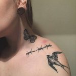 Barbed wire and swallow tattoo