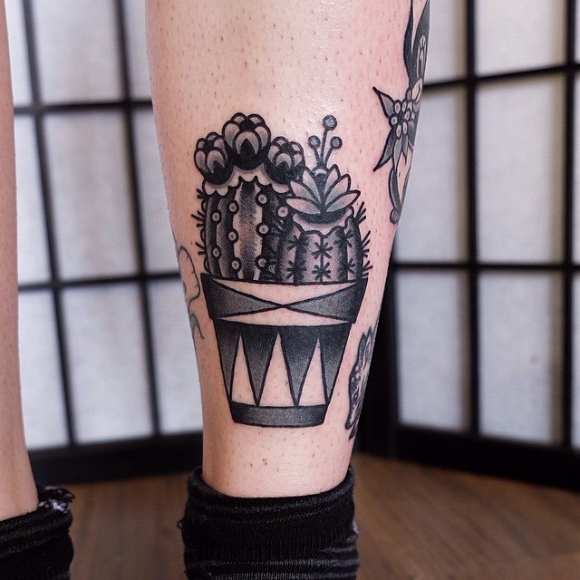 Black and grey cacti in a pot tattoo