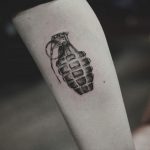 Black and grey grenade tattoo by kristian