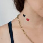Black and red small heart tattoos