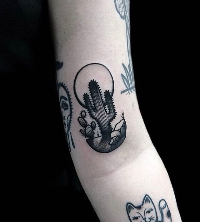 Black cactus tattoo by ethan jones