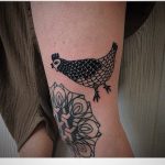 Black chicken tattoo