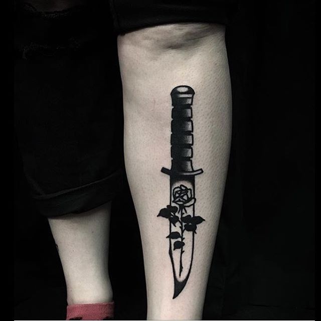 Black knife with rose tattoo