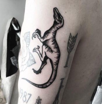 Black raptor tattoo