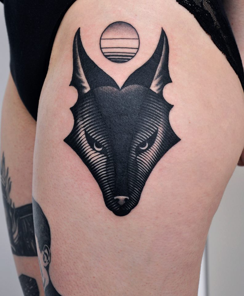 Black wolf head tattoo