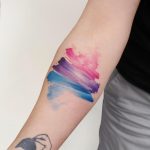 Blue, violet, and pink abstract tattoo