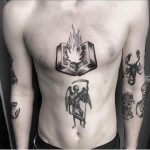 Burning book and angel of death tattoo