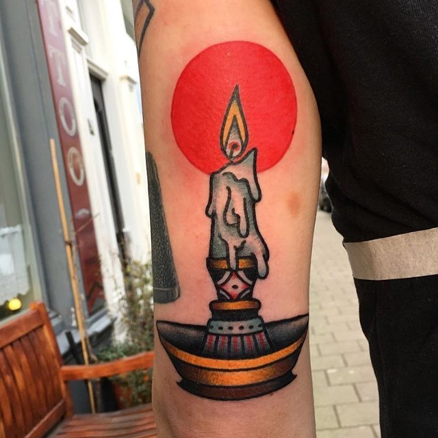 Burning candle and red light tattoo